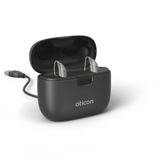 Oticon SmartCharger con cable, foto tomada desde un ángulo, Oticon More, modelo miniRITE R Audífonos con servicio ilimitado Auzen